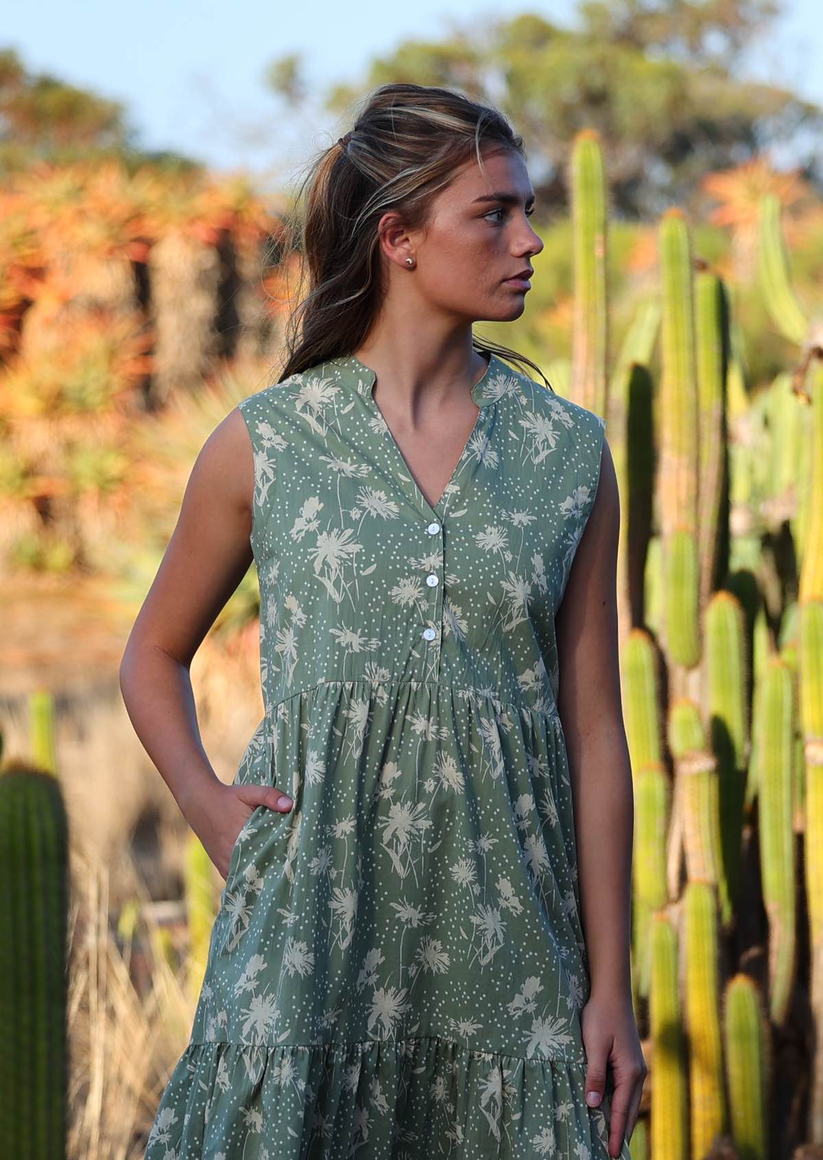 Close up of buttoned bodice that forms a V-neckline with a mandarin collar