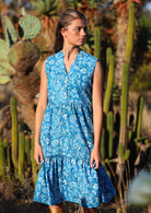 woman in blue floral cotton midi dress