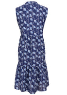Back view of sleeveless, below knee length cotton dress with two tiered skirt in navy blue based floral print 