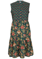 100% cotton sleeveless green based floral print dress with buttoned bodice, mandarin collar and two tiered skirt 