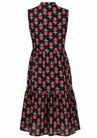 Back view of sleeveless, below knee length cotton dress with two tiered skirt in black based floral print 
