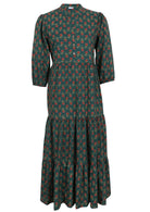 100% green based floral three tiered flowy maxi dress with buttoned bodice, 3/4 sleeves and mandarin collar 
