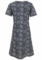 Back view of cotton dress with round neckline in navy blue based floral print. 