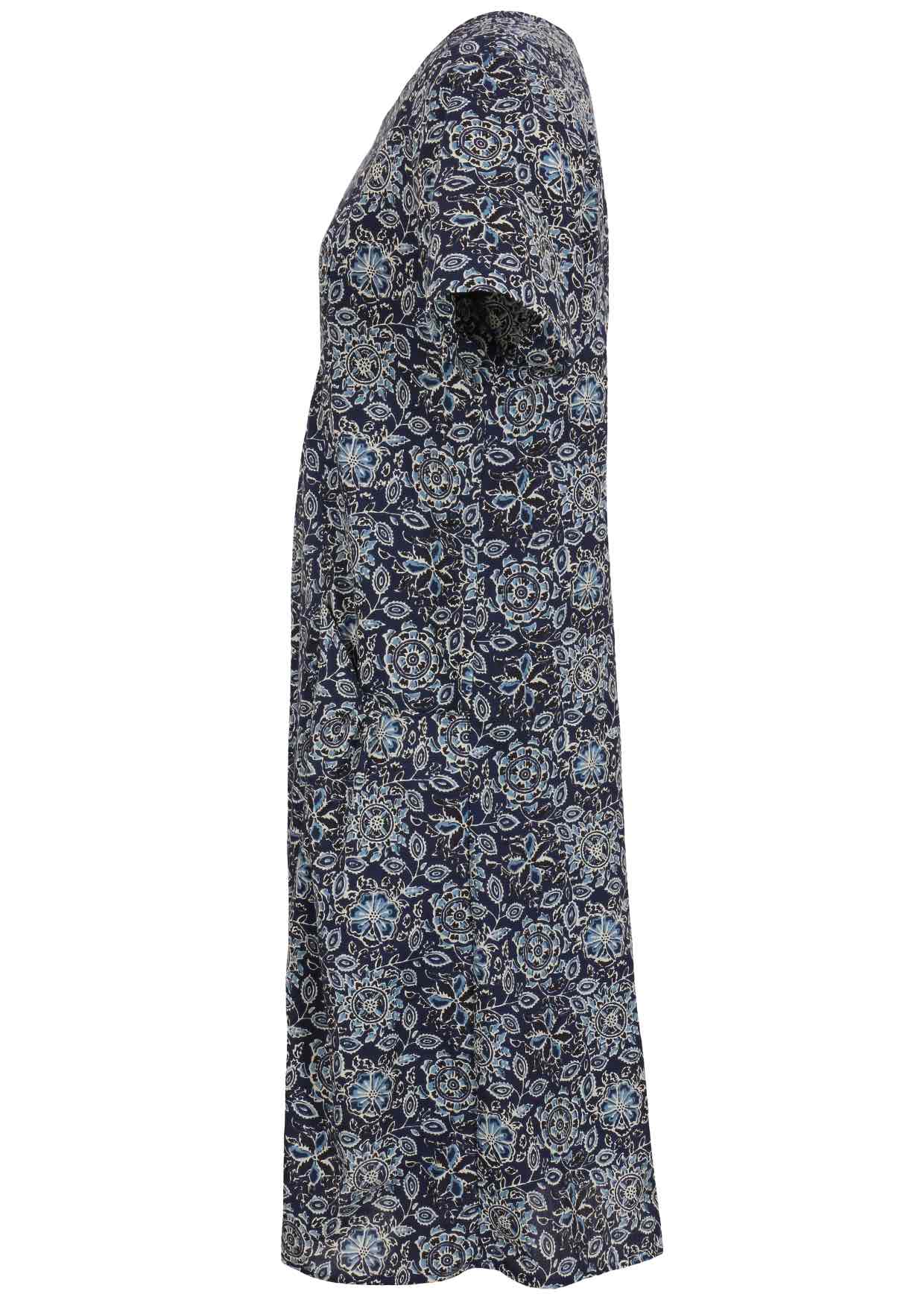Side view of cotton dress with round neckline and short sleeves in navy blue based floral print. 