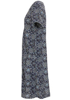 Side view of cotton dress with round neckline and short sleeves in navy blue based floral print. 