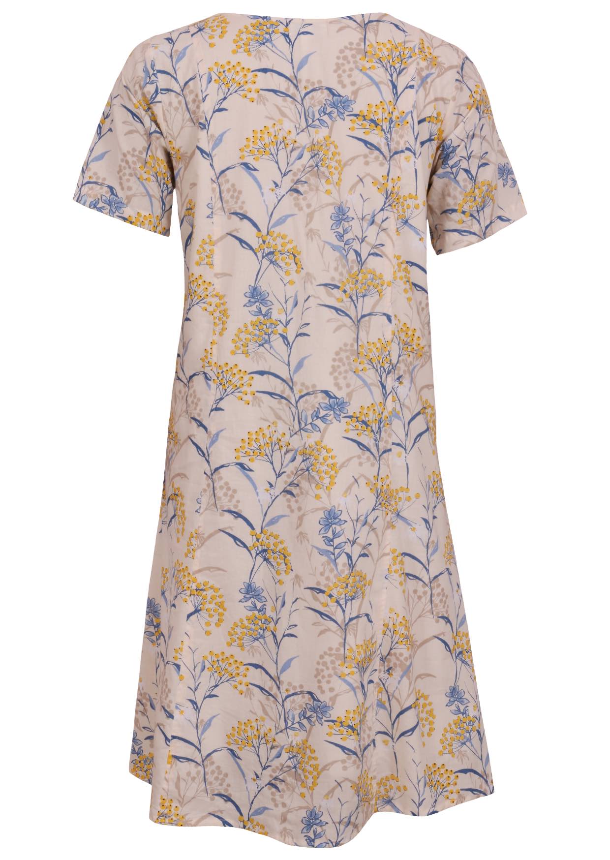Back view of cotton dress with round neckline in neutral based floral print. 