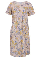 Front view of cotton dress with round neckline in neutral based floral print. 
