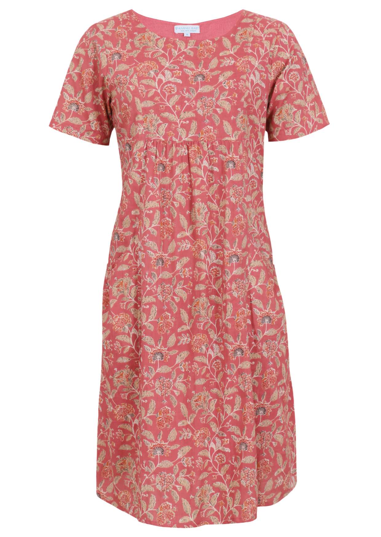 Front view of cotton dress with round neckline in rose pink based floral print. 