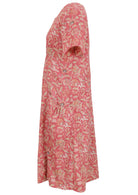 Side view of cotton dress with round neckline and short sleeves in rose pink based floral print. 