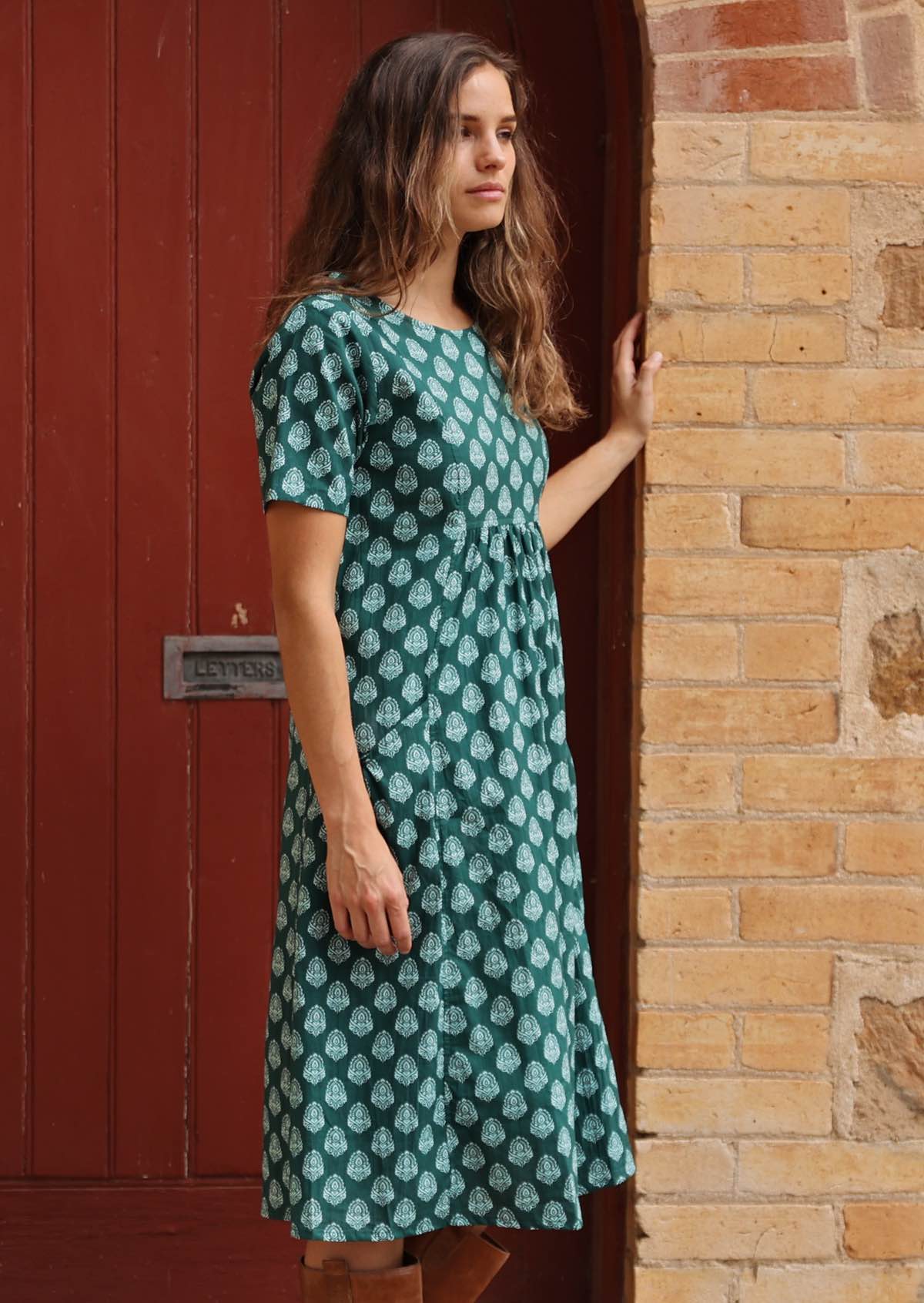 100% cotton dress with gathers in centre under the bodice, flanked by pockets