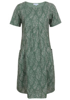 Front view of cotton dress with round neckline in sage green based floral print
