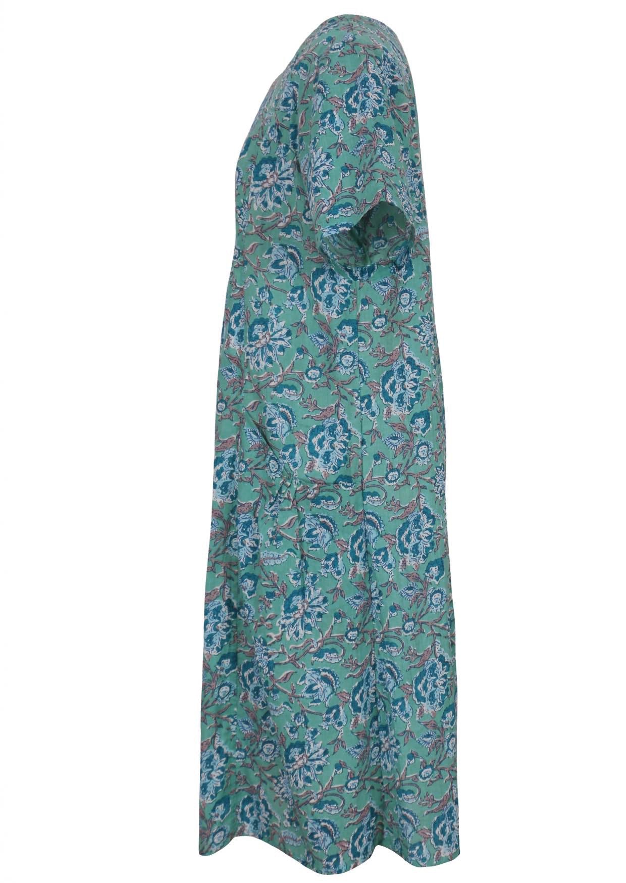 Side view of knee length cotton dress with short sleeves in indian floral print.