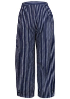 Back view of navy blue based print pants with elastic waist
