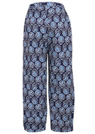 Back view of navy blue based print pants with elastic waist