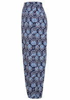Side view of navy blue based print pants with pockets