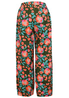 Back view of 100% cotton wide leg pants with elastic waist and pockets in olive green based floral print