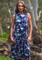 Cotton sleeveless dress with three tiers has hidden side pockets