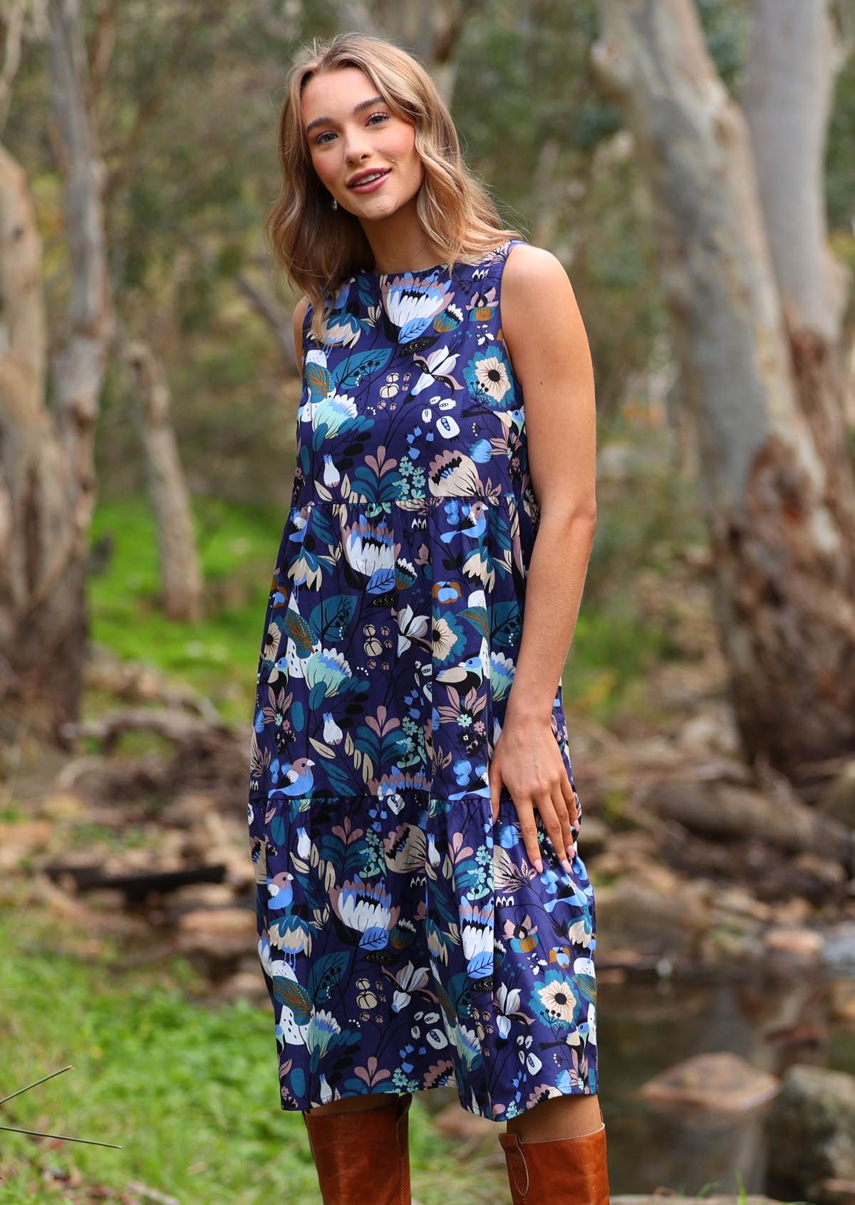 Floral print in blues and browns on a navy blue base cotton sleeveless dress