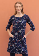 3/4 sleeved, above knee length cotton corduroy dress with pockets and wide round neckline.