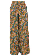 Back mannequin photo of rayon wide leg pants in green based floral print with elastic at back of waistband