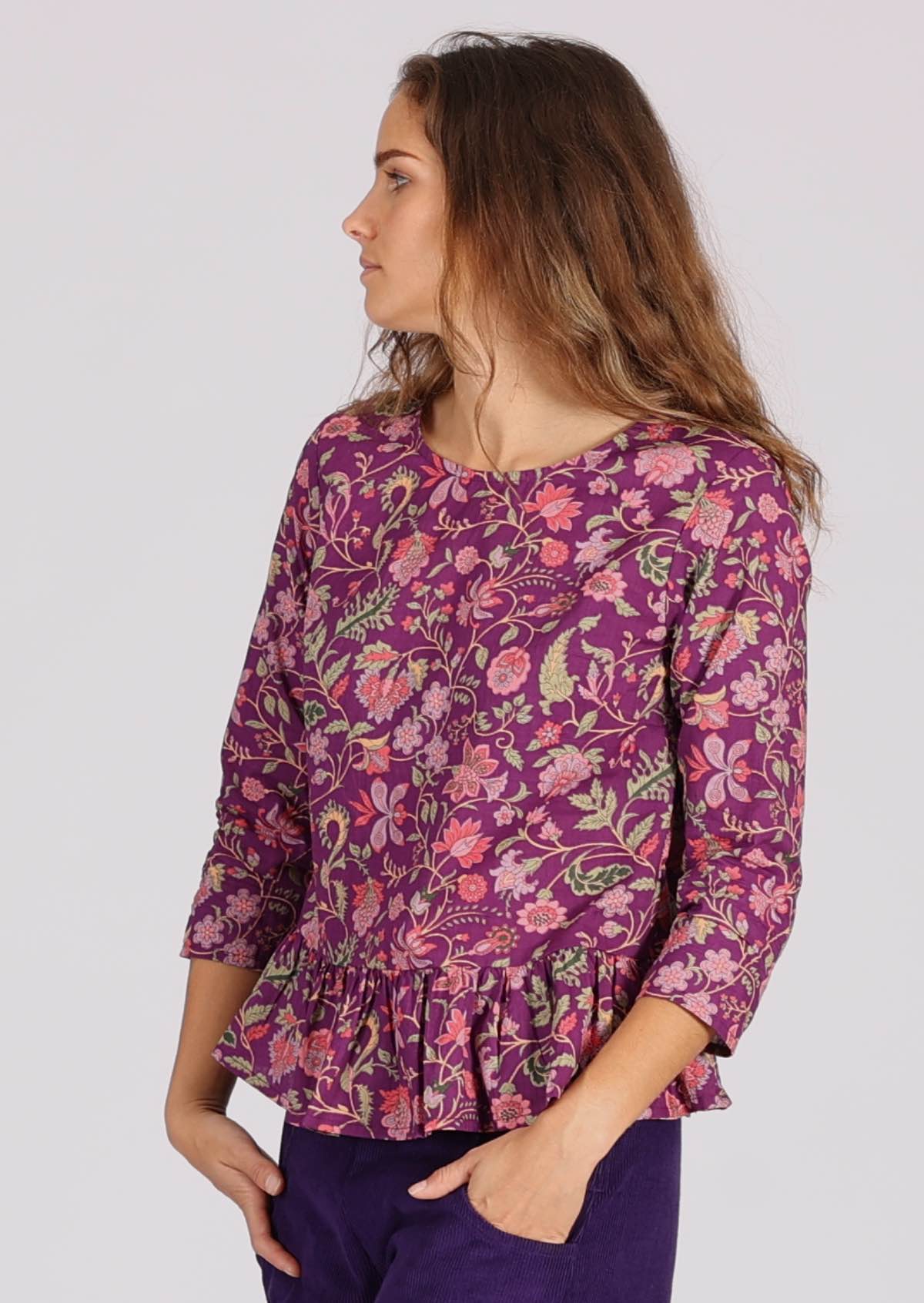 Round neckline, 3/4 sleeves, relaxed fit, peplum flair, cotton top