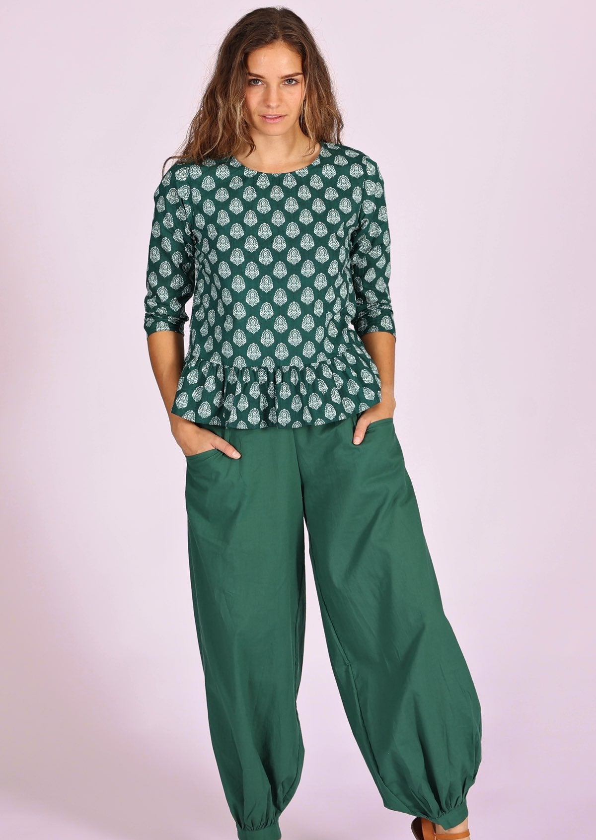 Comfort and style in this peplum top with 3/4 sleeves