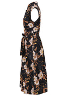 Side view of black based floral print cotton dress with pockets.