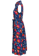 Side view of navy based floral print cotton dress with pockets.
