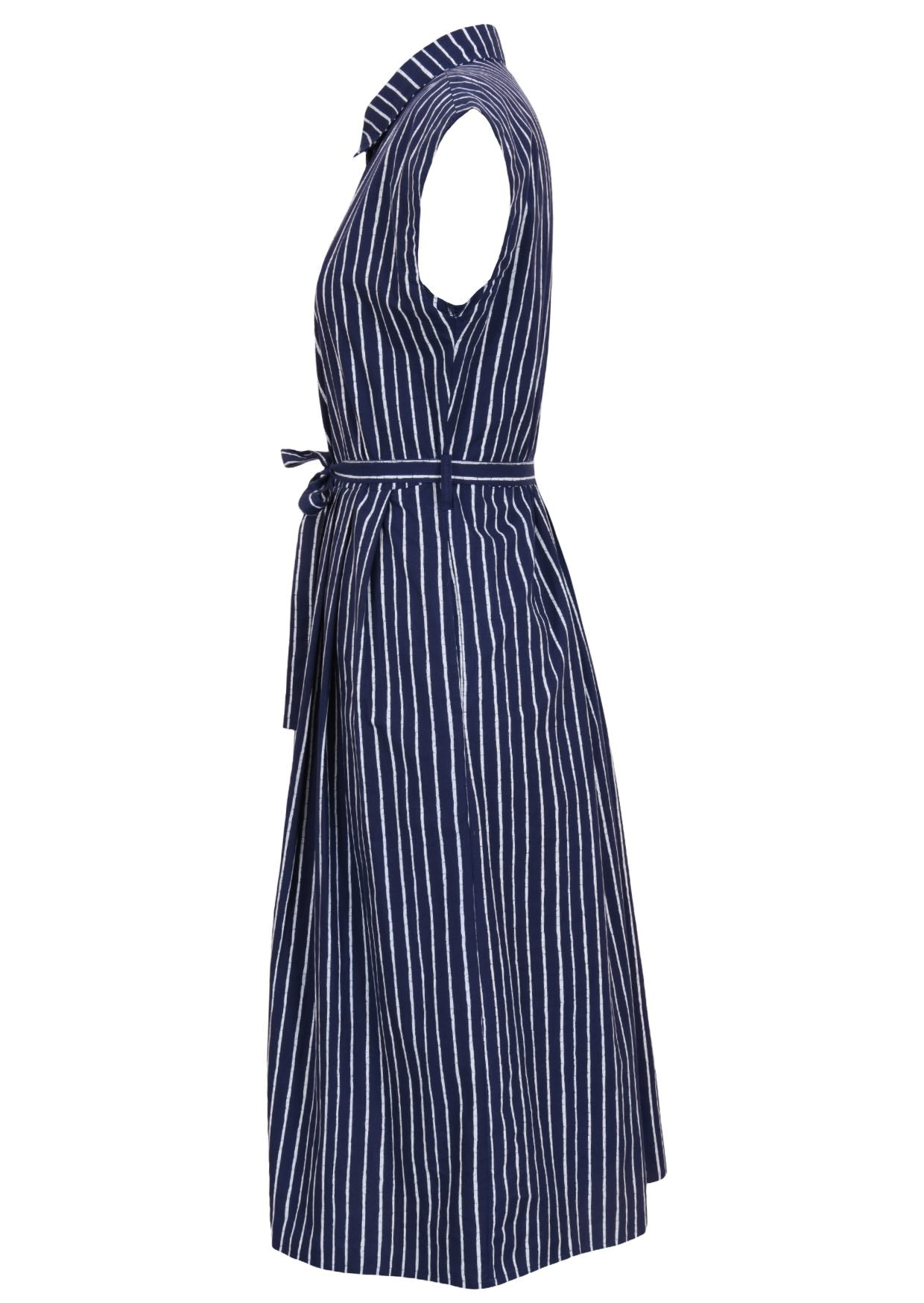 Side view of navy blue based print cotton dress with pockets.