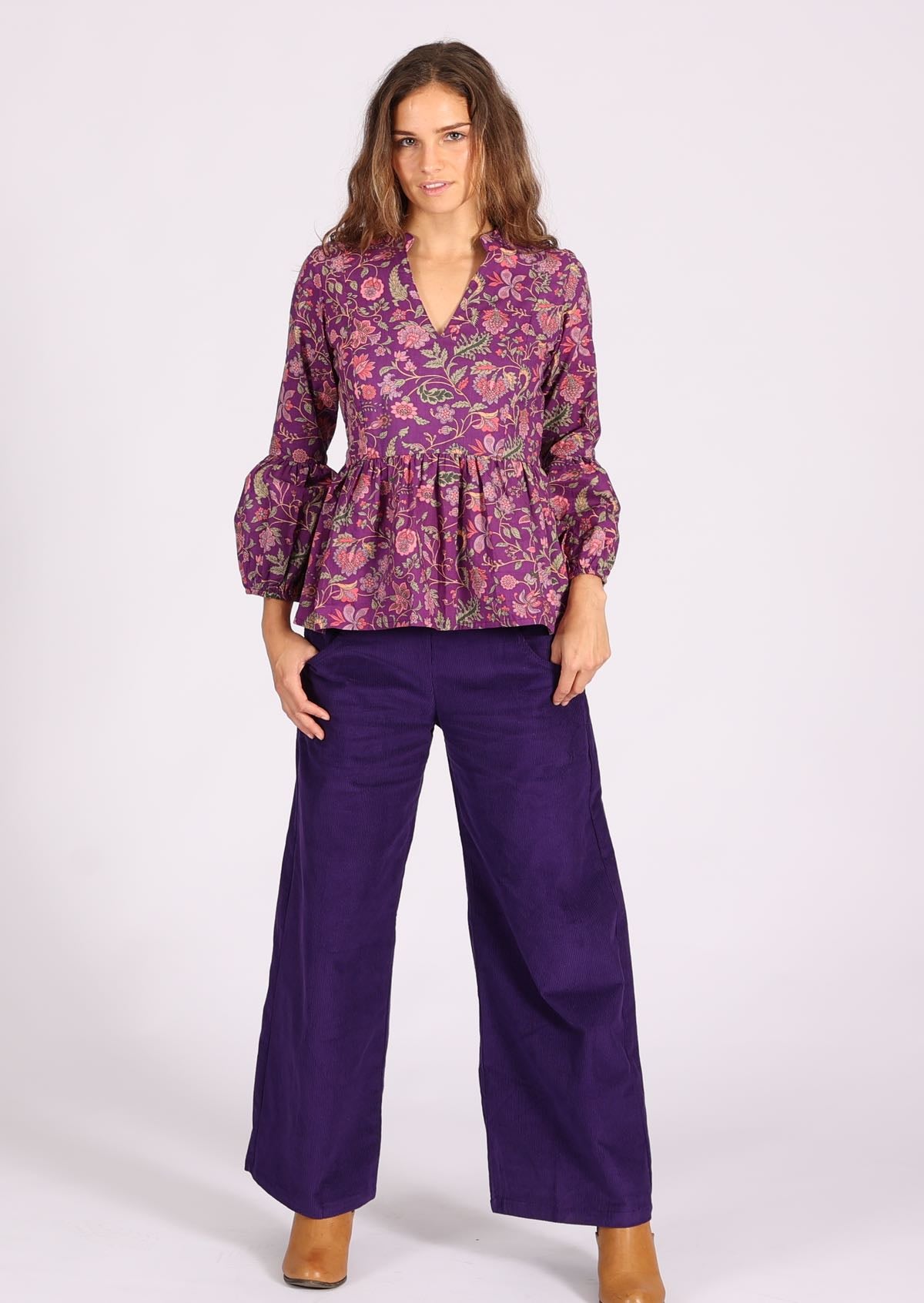 Cotton floral top with peplum flare reflected in the puffed sleeves