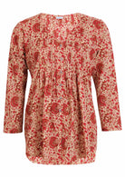 gentle cream based floral print cotton button through shirt with pin tucks across the bodice and a V-neckline