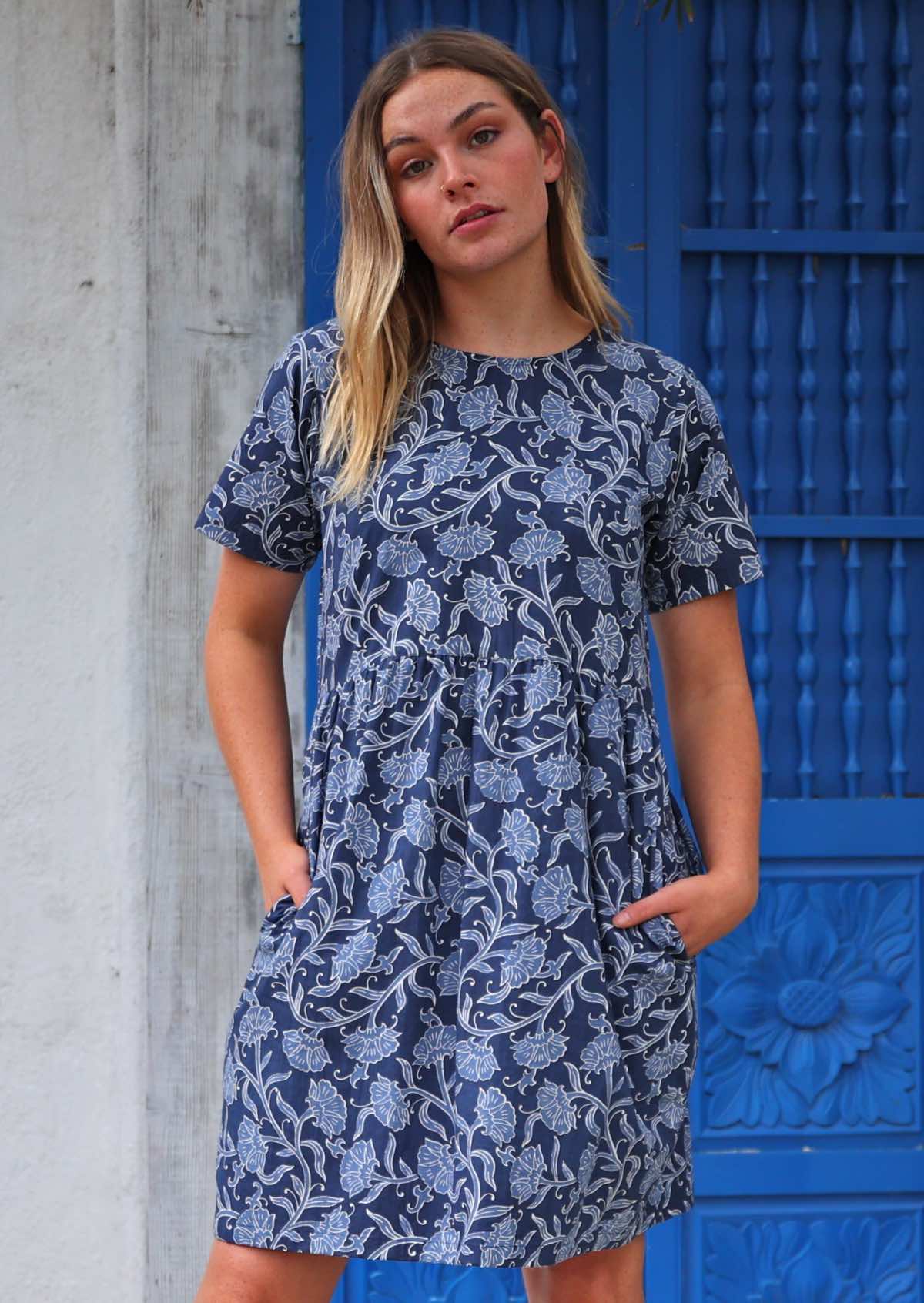 Model standing with hands in pockets wearing Mabel Dress Neela 100 percent cotton women's dress