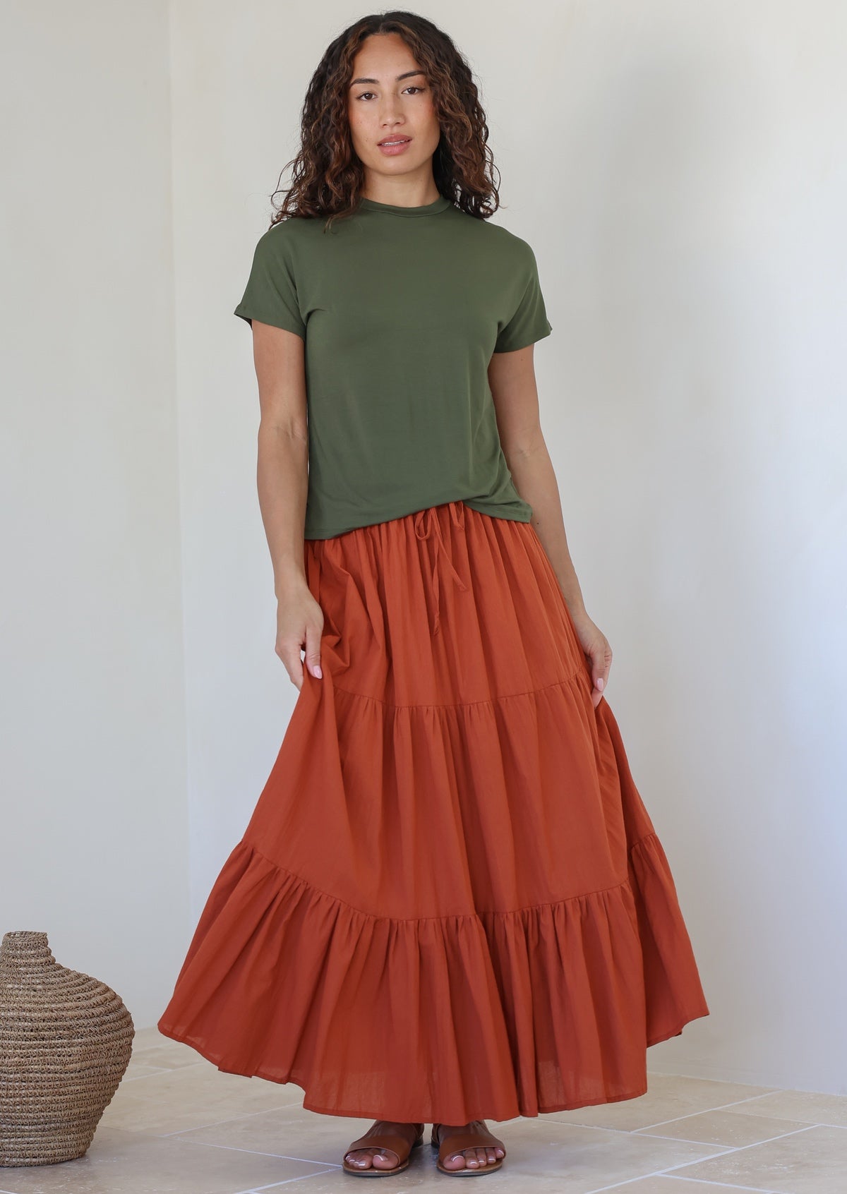 Woman wearing a Maxi Skirt in rust shade, 100% cotton skirt with drawstring waistband