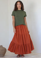 Woman wearing a Maxi Skirt in rust shade, 100% cotton skirt with drawstring waistband