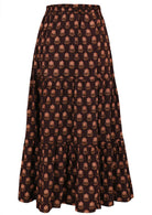 Cotton three tiered maxi skirt in floral print on a dark brown earthy base.