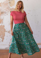 Model wearing 100 percent cotton maxi skirt with elastic waist and drawstring 