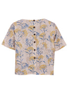 100% cotton short sleeve top with round neckline and non functional buttons down the back