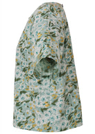 Side view of pale sage green based daisy floral print cotton relaxed fit short sleeved top with round neckline