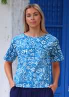 100% cotton blue floral boxy style blouse on woman with blonde hair 