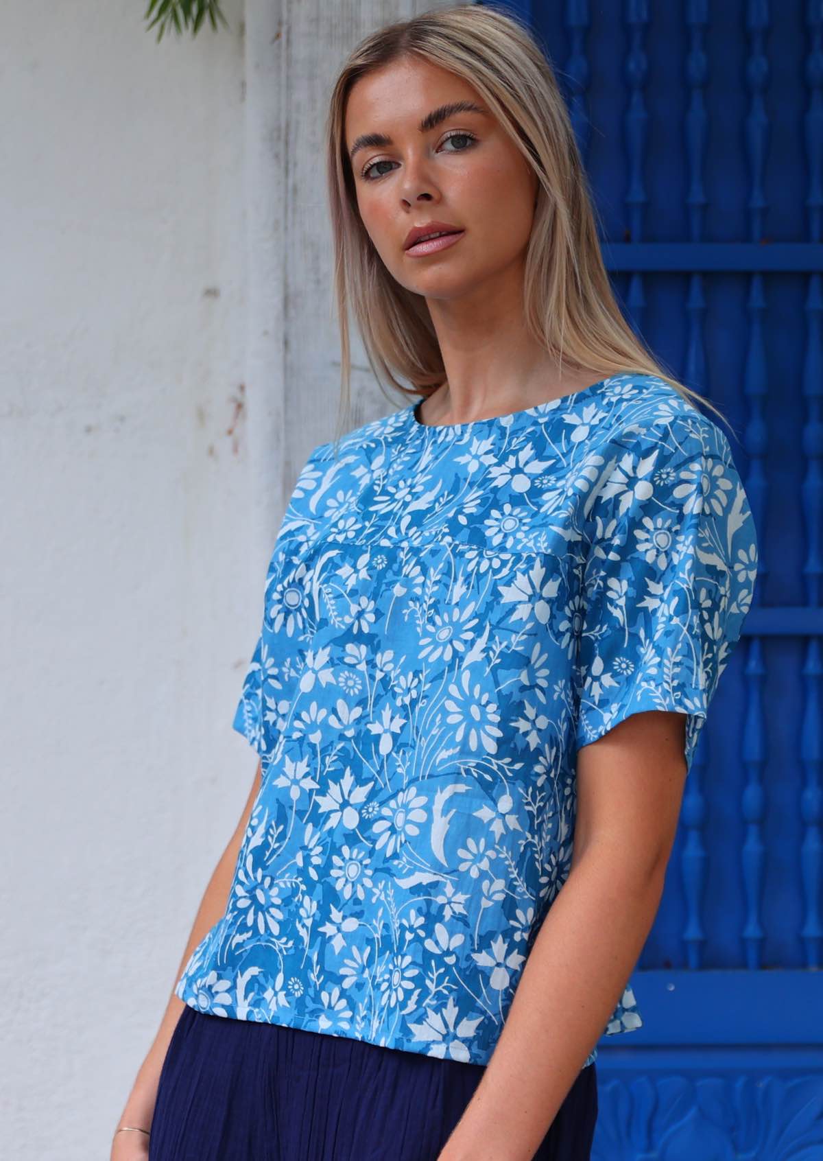 100% cotton blue floral blouse on woman with blonde hair 