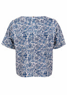 White based blue floral print cotton relaxed fit short sleeved top with round neckline