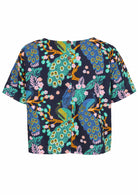 Back view of navy blue based floral print cotton relaxed fit short sleeved top with decorative buttons through the centre back