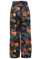 Botanical print wide leg cotton pants in black with side zipper, pockets and pleated ankles