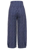 Back view of 100% cotton wide leg cotton pant with navy blue based print with pockets.