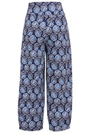Back view of 100% cotton wide leg cotton pant with navy blue based print with pockets.