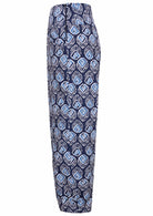 Side view of 100% cotton wide leg cotton pant with navy blue based print with side zip.