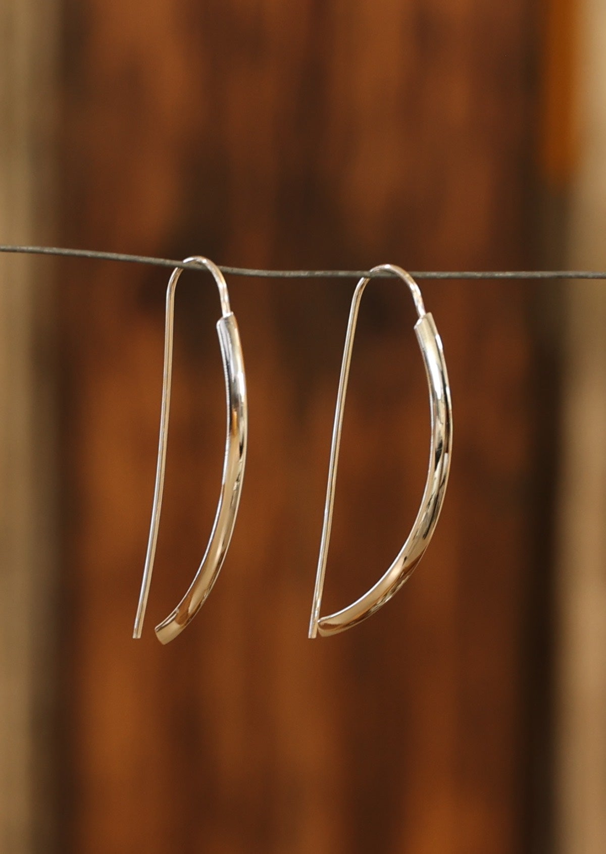 50mm long sleek silver fixed hook earrings with subtle ridge in front