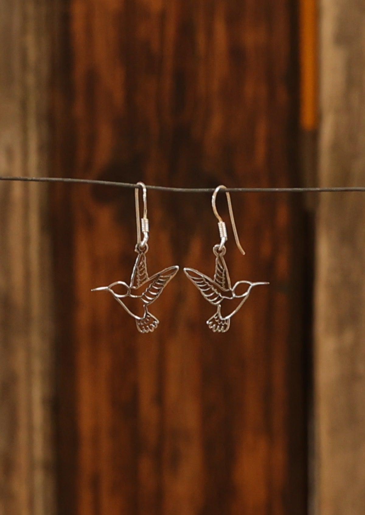 Sterling silver delicate hummingbird cutout design earrings 