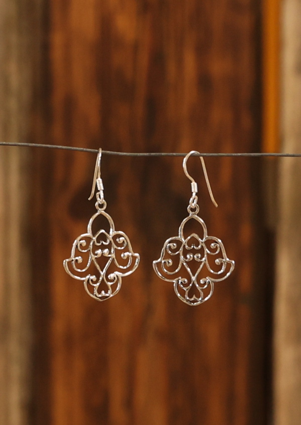 Silver filigree earrings measuring 22mm wide and 40mm long