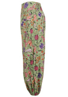 Green based multi-coloured floral print harem cotton pants with buttoned ankles.